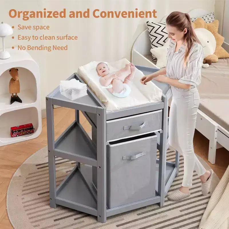 Table à langer d'angle compacte avec tiroir de rangement, panier à linge et matelas imperméable, meuble à langer moderne en bois pour chambre de bébé, gris